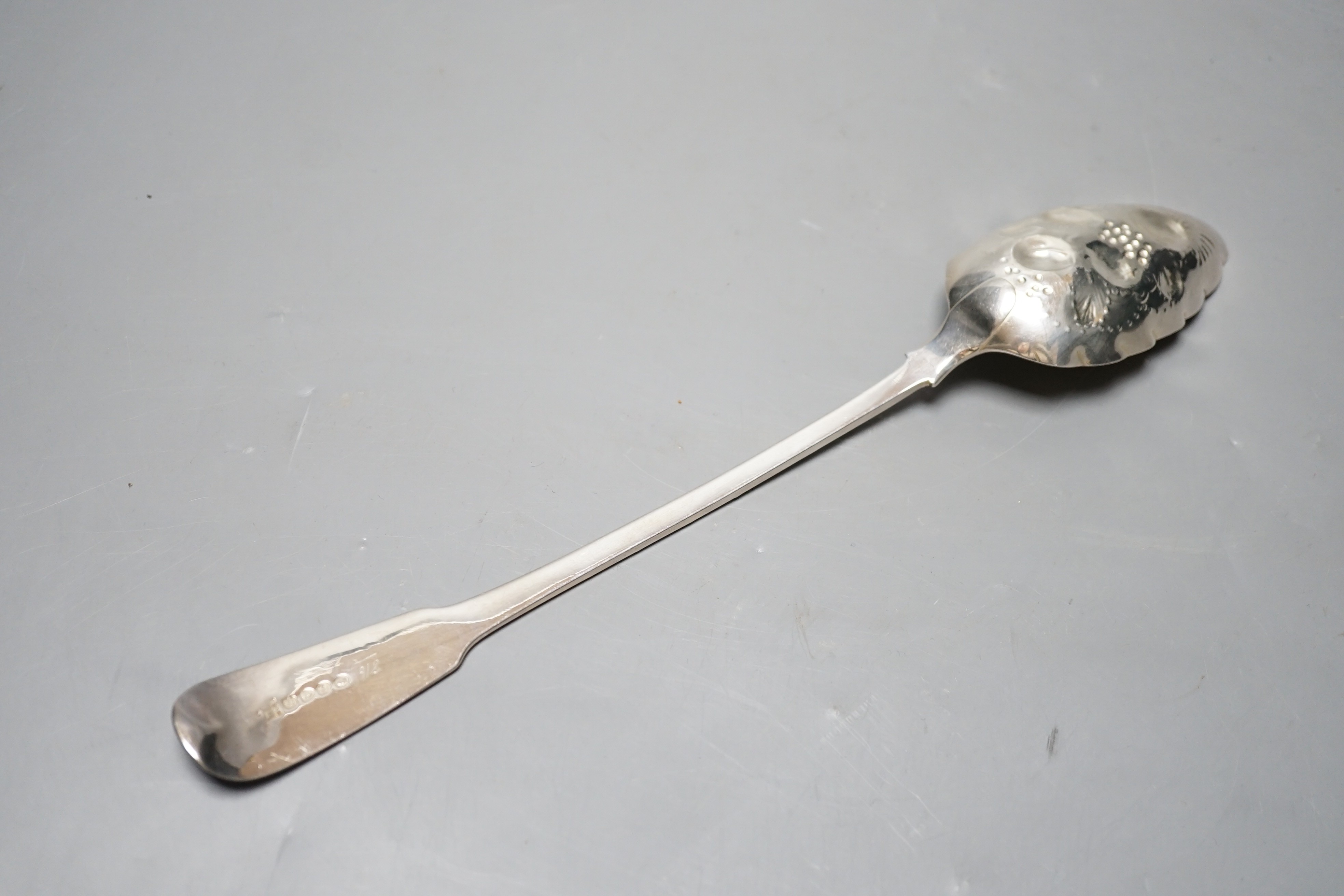 A late George III silver fiddle pattern embossed 'berry' basting spoon, Eley & Fearn, London, 1817, 30.6cm, 113 grams.